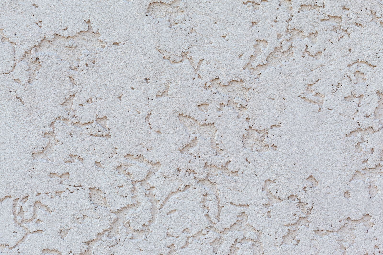 Wall with rough textured stucco before plastering